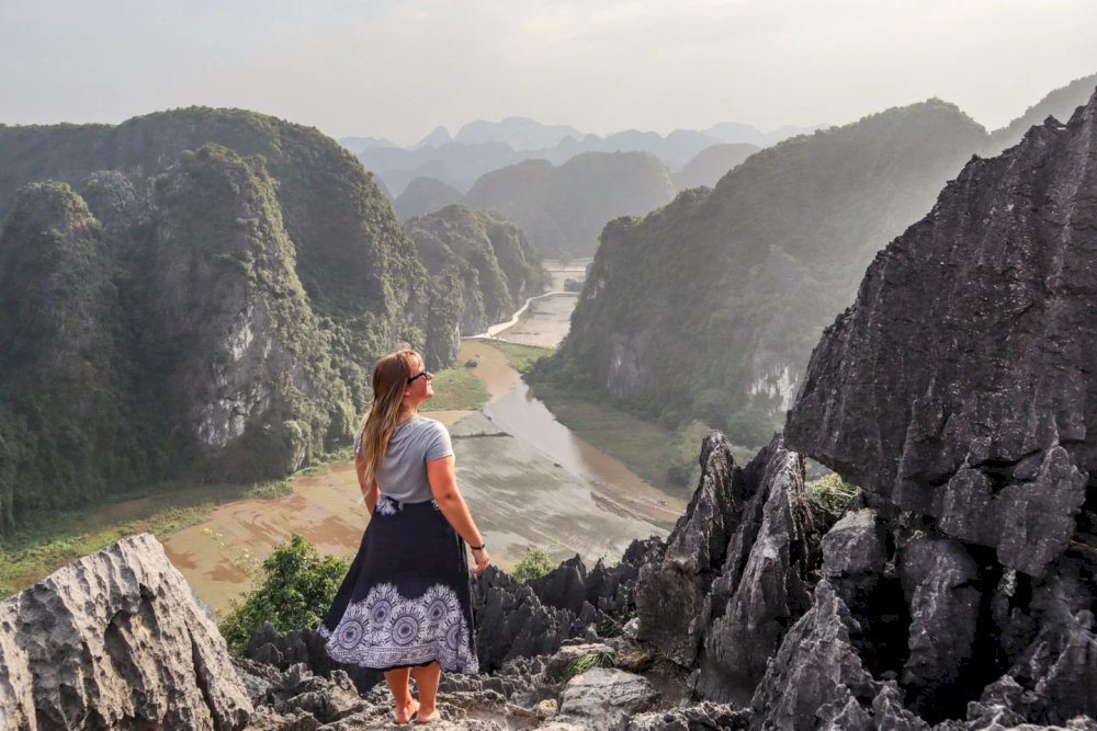The stone stairway winds upward through cliffs and clouds, leading you to the breathtaking heights of Dragon Mountain Ninh Binh